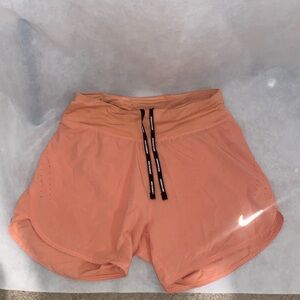 Nike shorts light orange/peach color